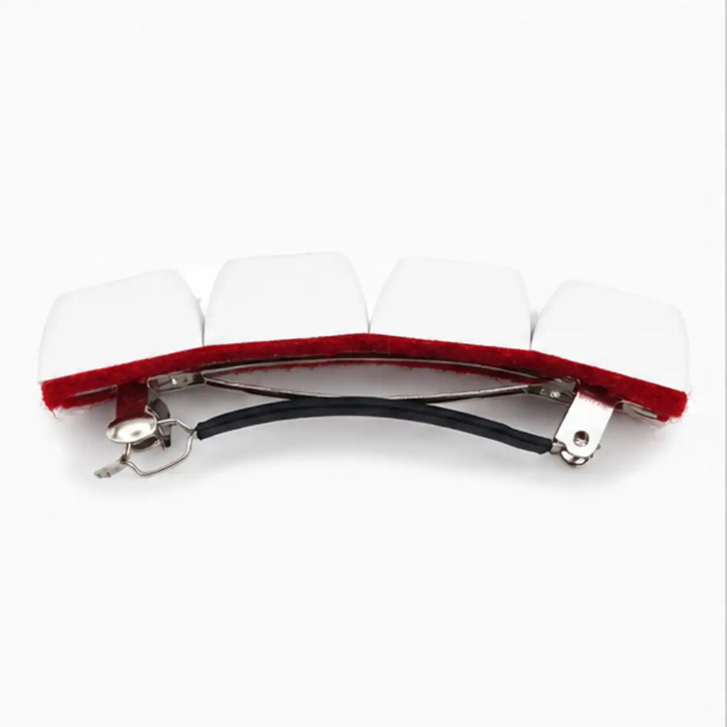 barrette à cheveux femme N.R.V. vue de côté avec quatre touches de clavier